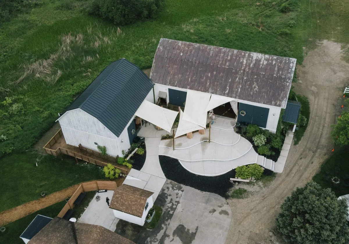 Aerial drone view of historic 1870s barn at Briar Barns wedding venue Sparta Michigan