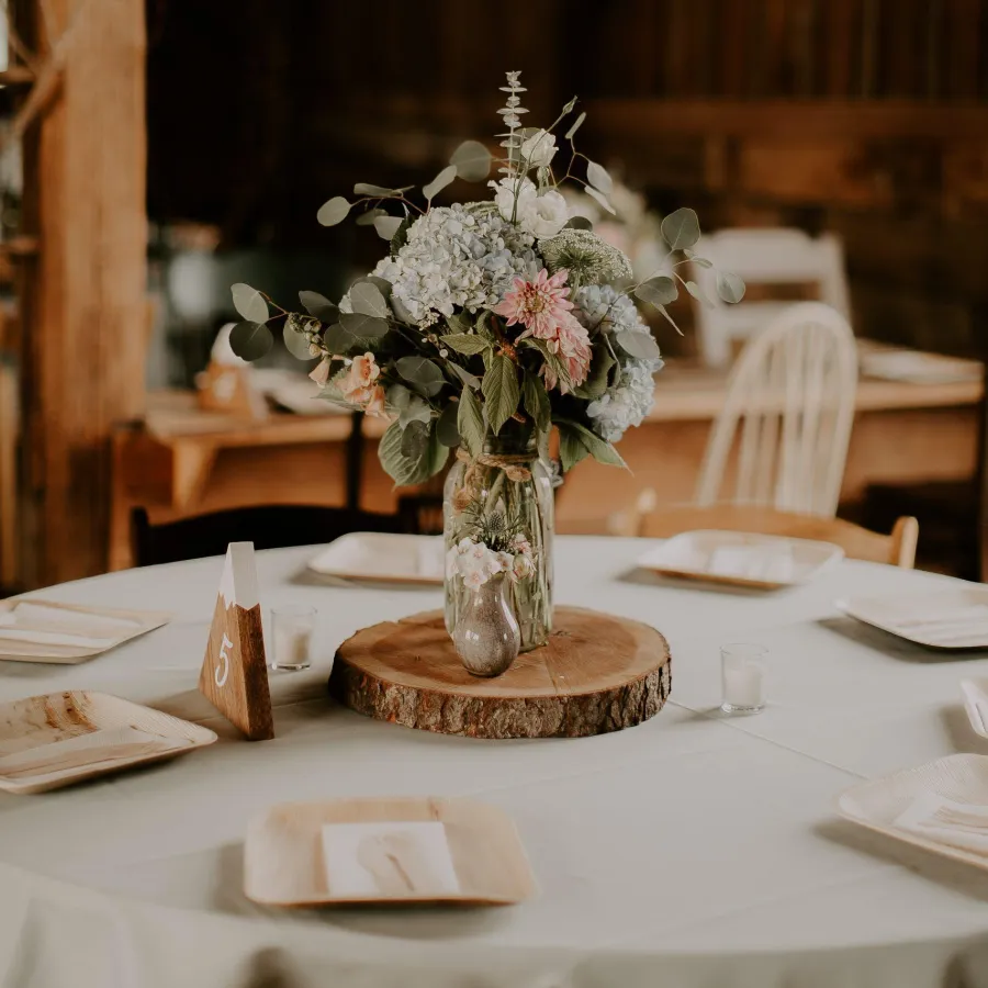 Wedding table floral centerpiece decoration at Briar Barns historic barn venue Sparta Michigan